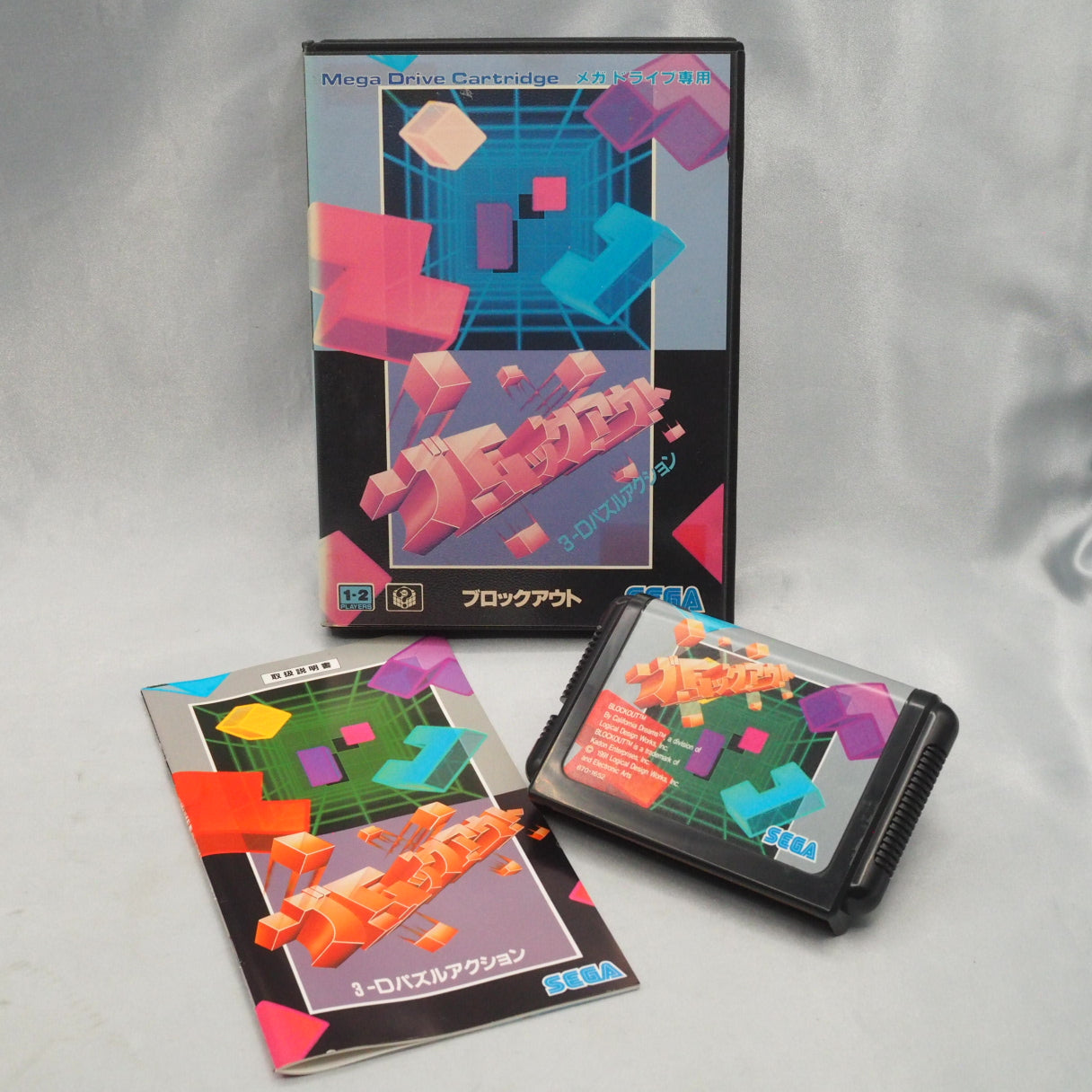 Block Out (1991, Mega Drive) is a 3D falling-block puzzle by California Dreams—rotate polycubes into a pit and clear full lay