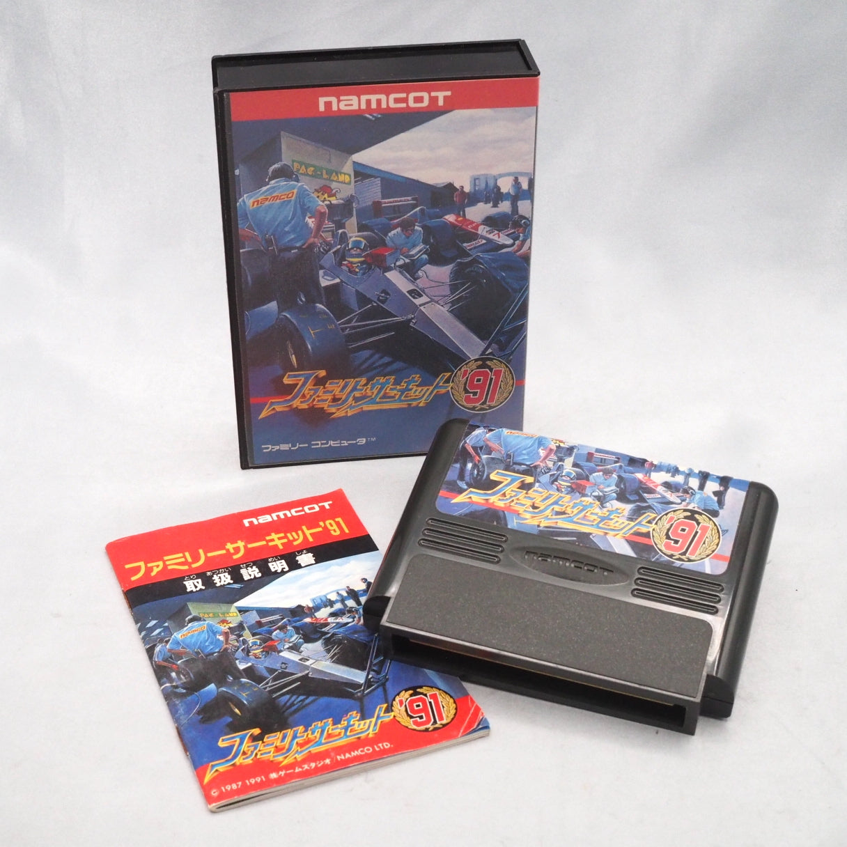Family Circuit '91 (1991), a Famicom top-down racer by Game Studio and Namco, with deep car tuning and a rare built-in track 
