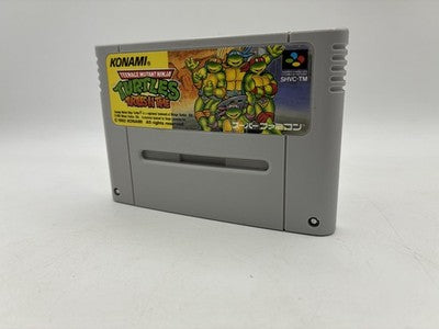 Konami's SNES port (1992) kept the chaos — four Turtles, time travel, throwing enemies at your face. Arcade power ported to t