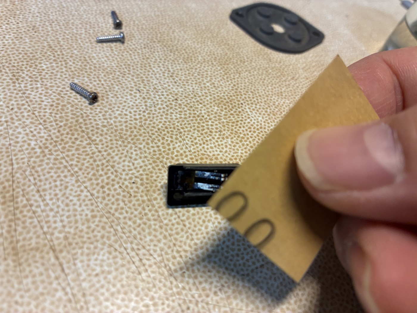 Burnishing the switch contact with fine sandpaper and lifting the metal contact leaf