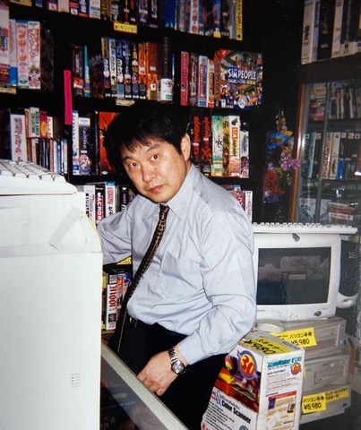 My father inside the shop, surrounded by the games and PC software he sold. Late 1980s to early 1990s.